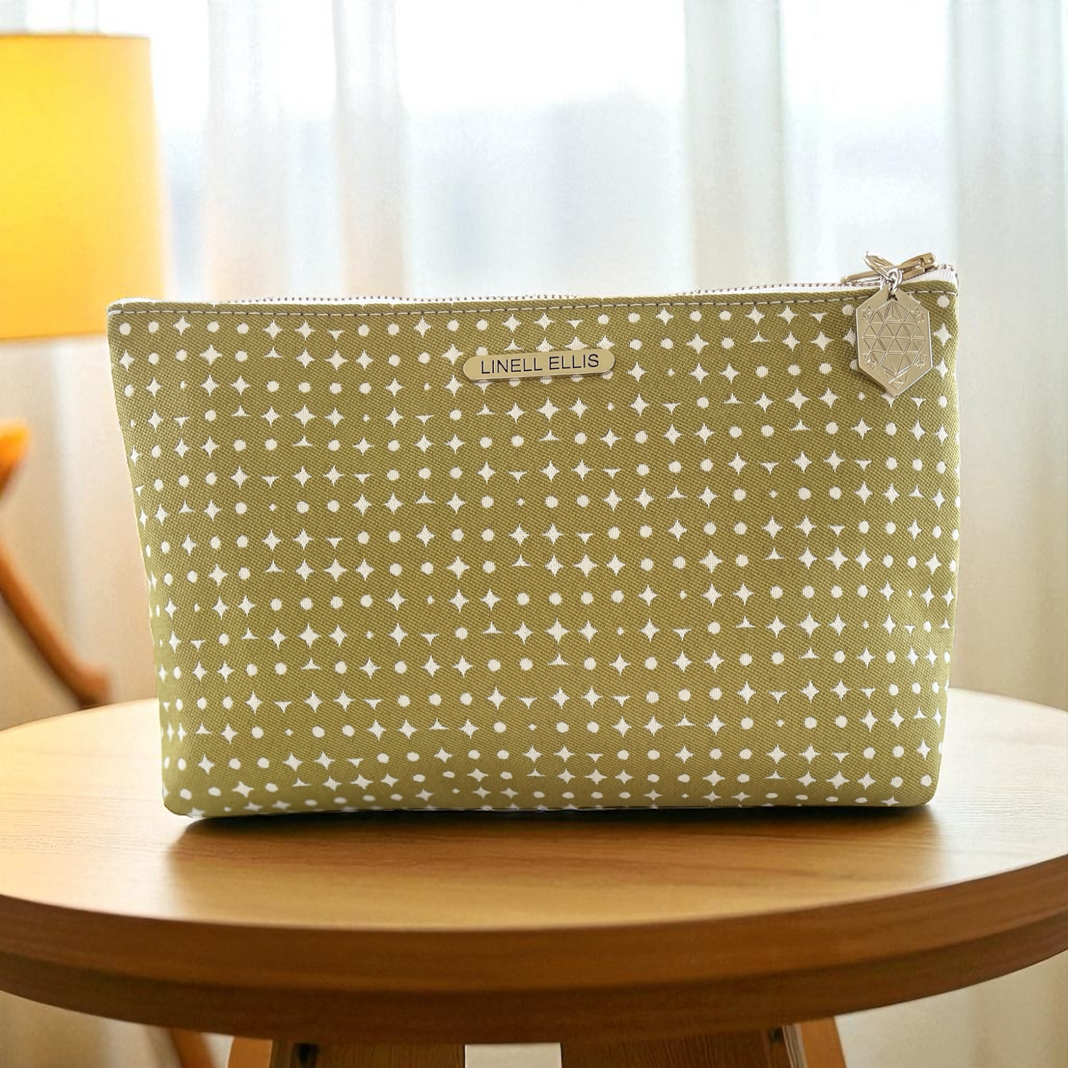 Green pouch with white pattern on a wooden table